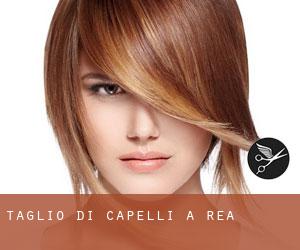 Taglio di capelli a Rea