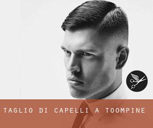 Taglio di capelli a Toompine